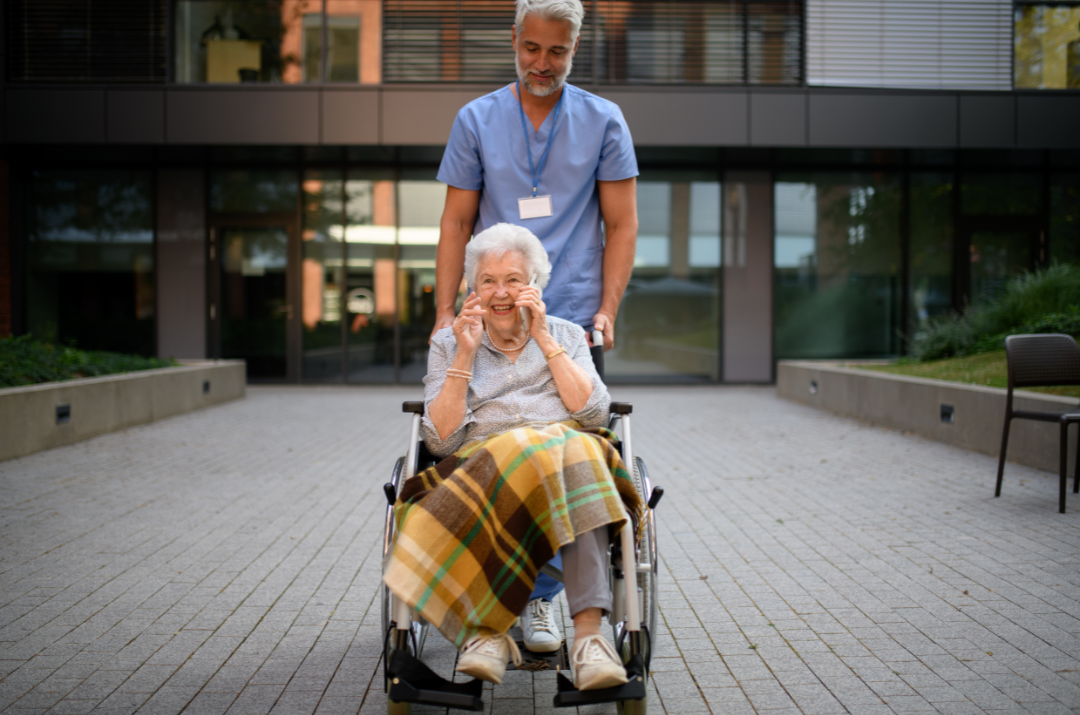 Elderly women leaving assisted living building