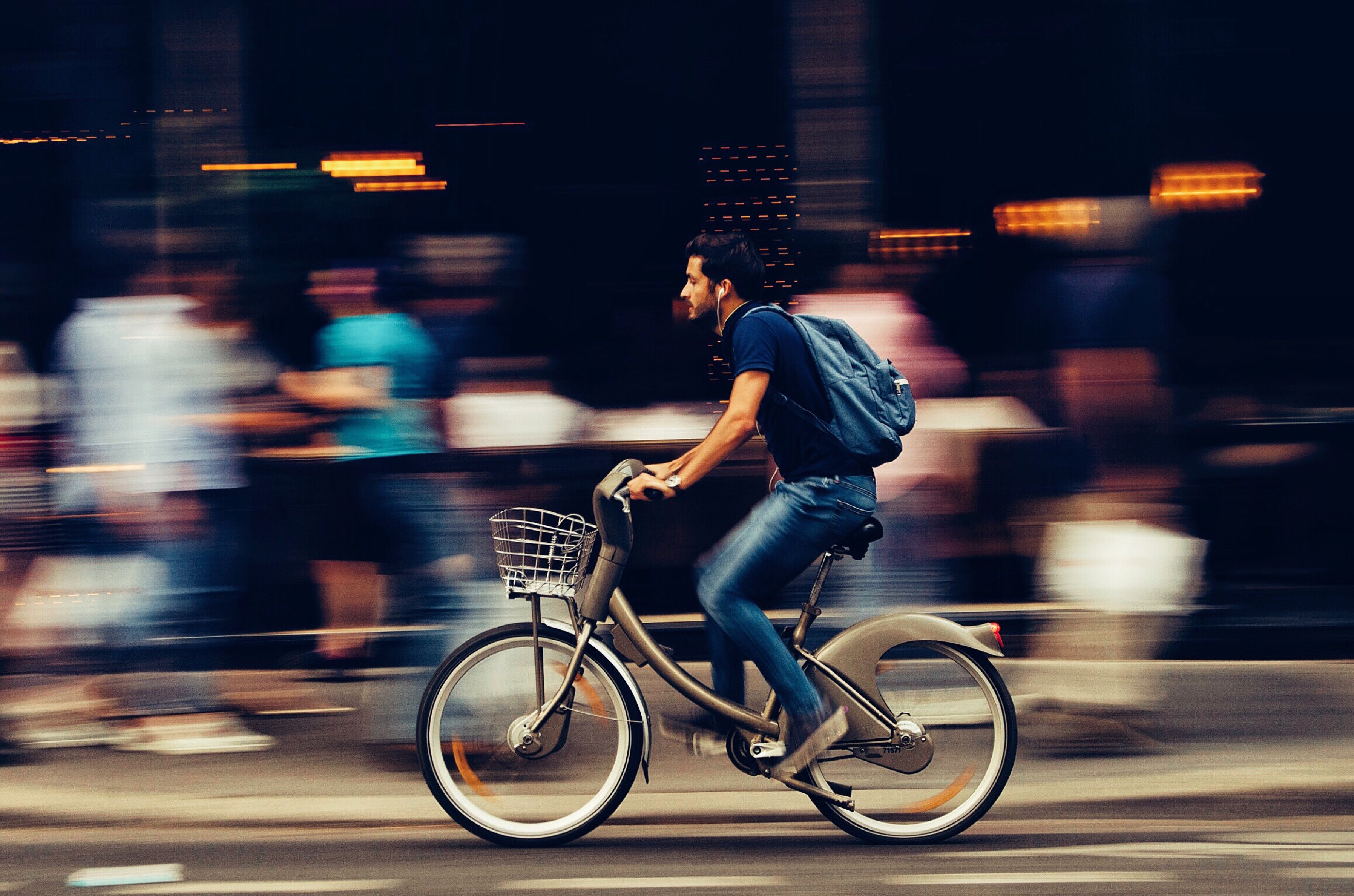 https://www.pexels.com/photo/man-riding-bicycle-on-city-street-310983/